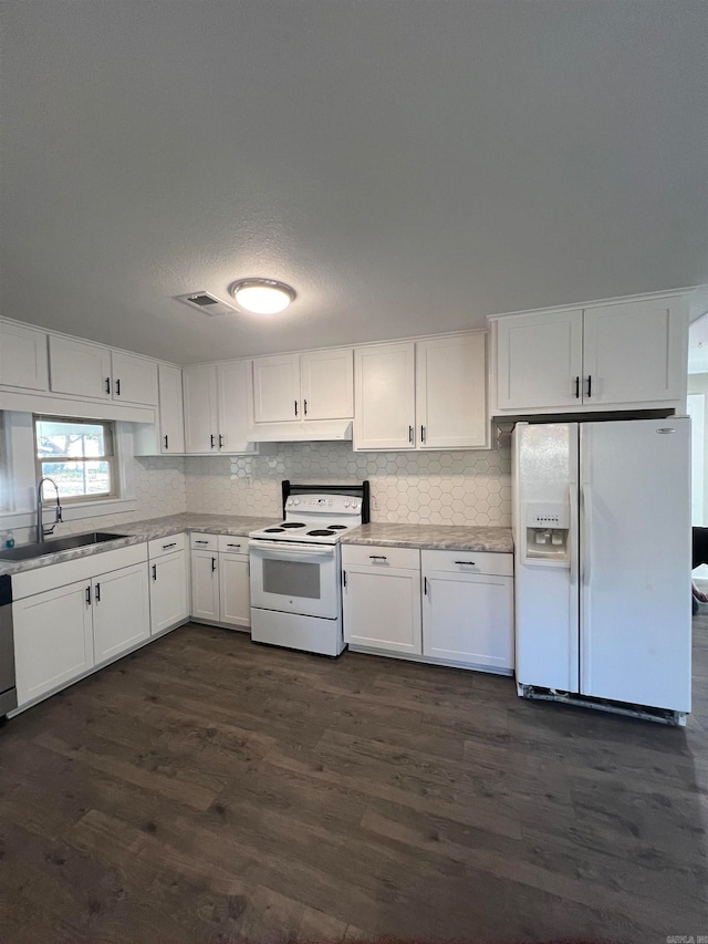 kitchen featuring white cabinets, dark hardwood / wood-style flooring, white appliances, and sink