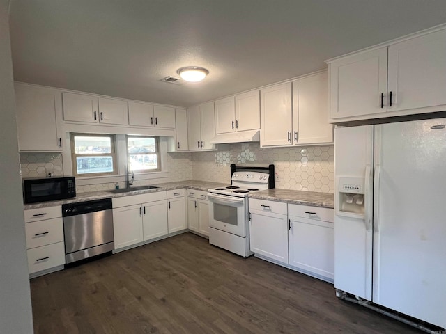 kitchen with white cabinets, white appliances, and sink