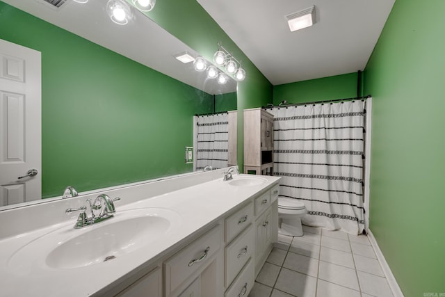 bathroom featuring walk in shower, tile patterned flooring, vanity, and toilet