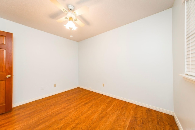 unfurnished room with hardwood / wood-style floors, a textured ceiling, and ceiling fan