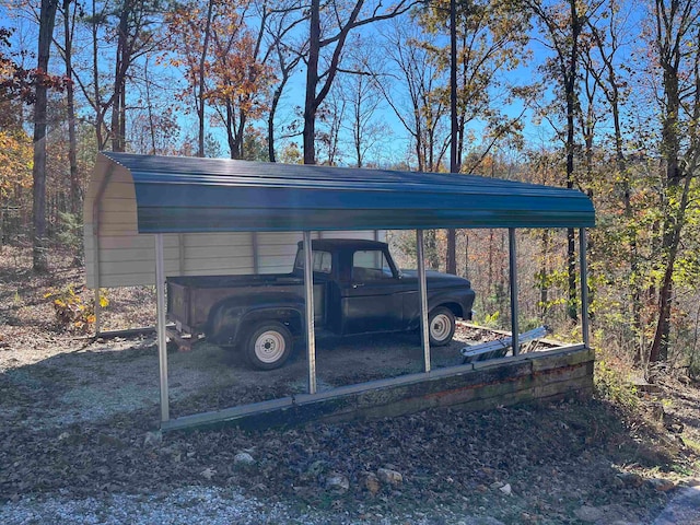 view of vehicle parking featuring a carport