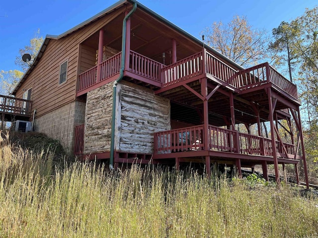 1217 Lovell Ln, Mountain View, AR 72560 - back of house featuring a deck and stone siding
