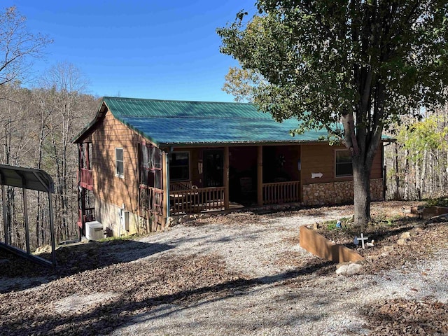 1217 Lovell Ln, Mountain View, AR 72560 - view of front of property with a porch, metal roof, and a detached carport
