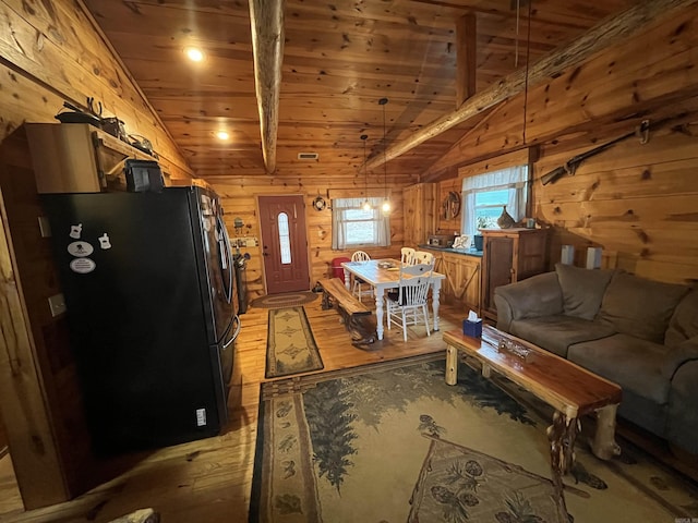 1217 Lovell Ln, Mountain View, AR 72560 - kitchen with freestanding refrigerator, wooden walls, vaulted ceiling, wooden ceiling, and light wood-style floors