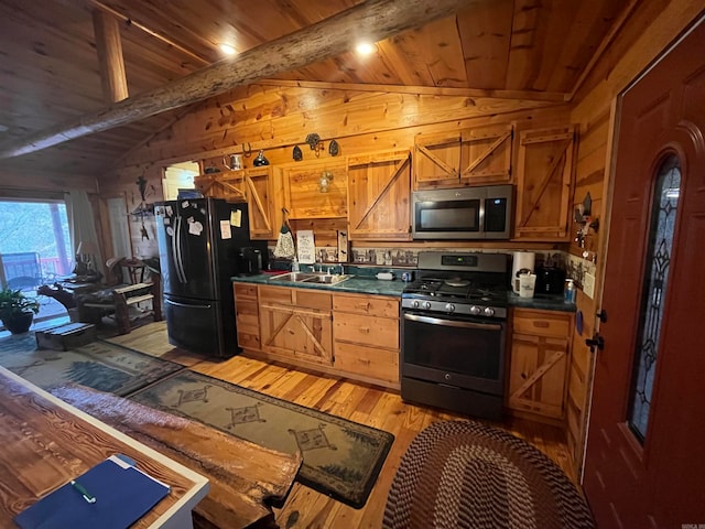 kitchen with sink, vaulted ceiling with beams, light hardwood / wood-style flooring, wood ceiling, and appliances with stainless steel finishes