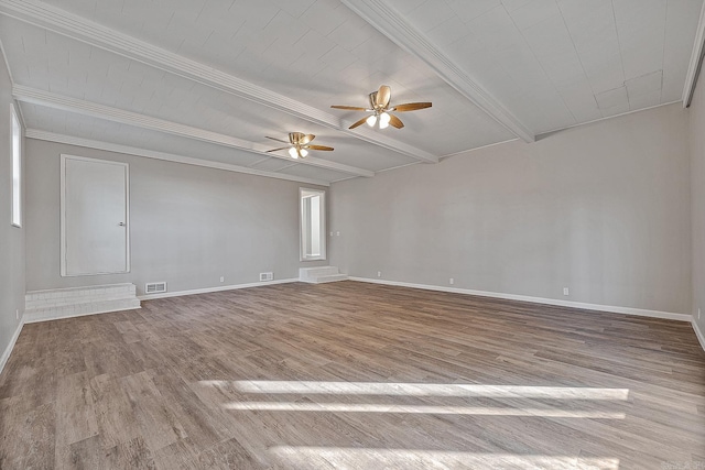 spare room with beamed ceiling, ceiling fan, light wood-type flooring, and ornamental molding