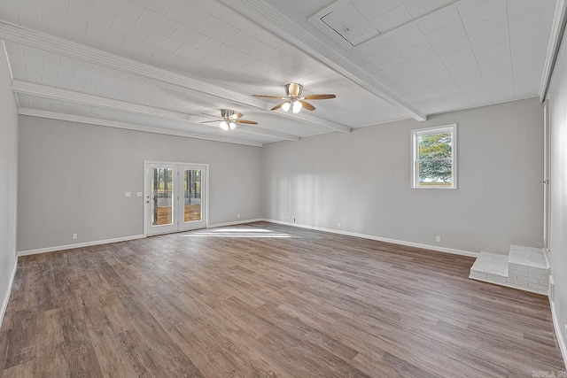 spare room with beam ceiling, hardwood / wood-style flooring, ceiling fan, and ornamental molding