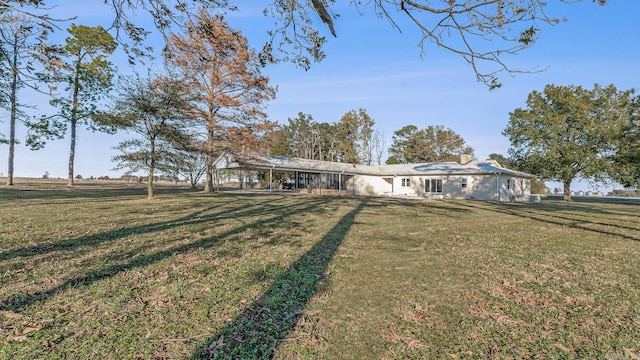 view of front of home featuring a rural view and a front yard