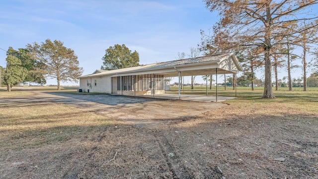 exterior space with a carport