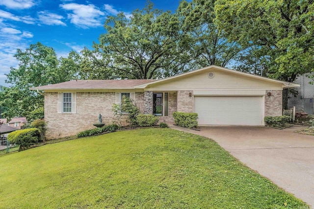 ranch-style home featuring a garage and a front lawn