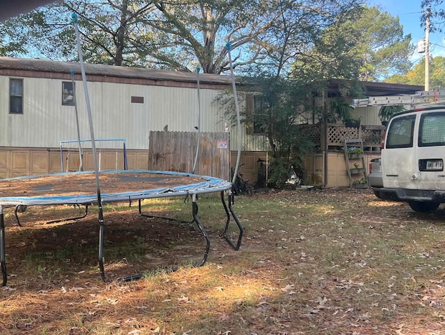 view of yard with a trampoline