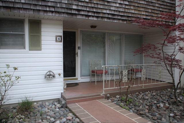 doorway to property featuring a porch