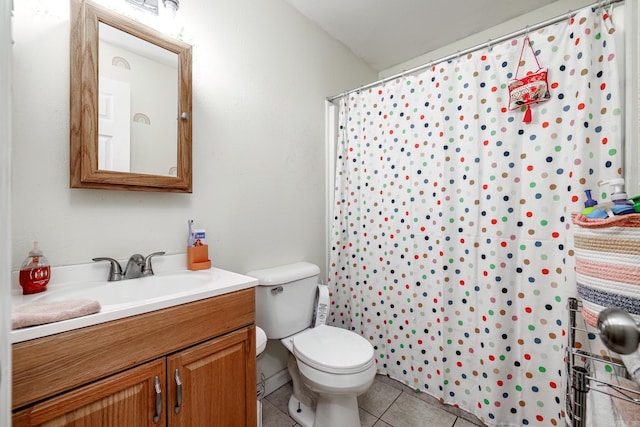 bathroom with tile patterned flooring, vanity, toilet, and a shower with curtain