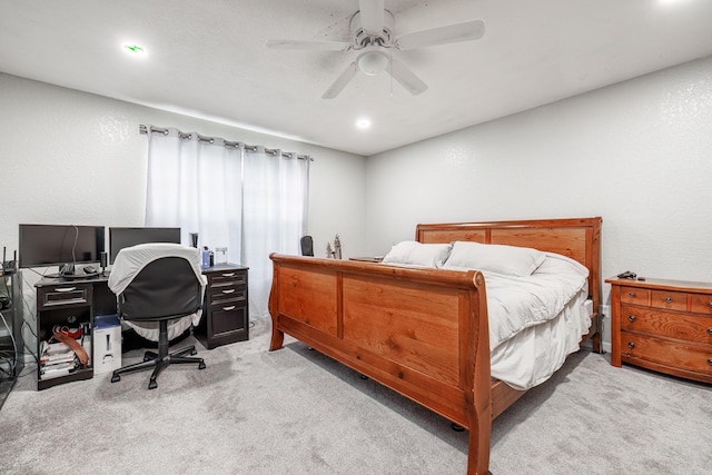 bedroom with light carpet and ceiling fan