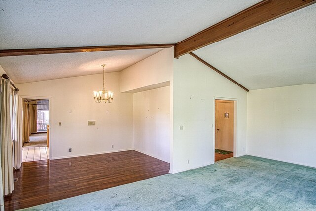 unfurnished room featuring vaulted ceiling with beams, a chandelier, dark wood-type flooring, and a textured ceiling