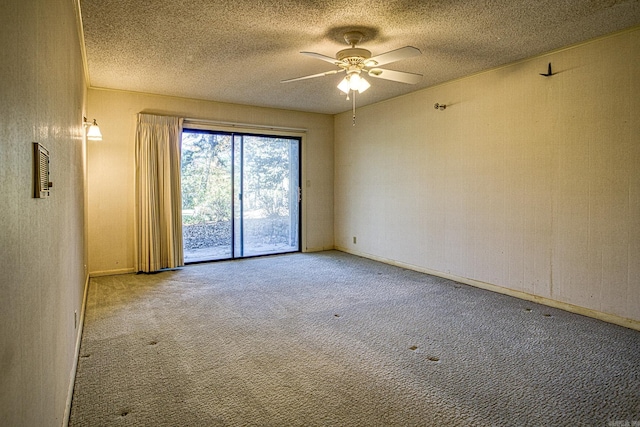 unfurnished room featuring light carpet, ceiling fan, and a textured ceiling