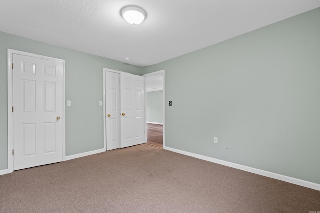 unfurnished bedroom with carpet