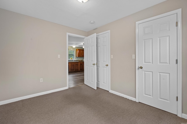 unfurnished bedroom featuring carpet flooring