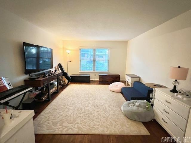 living room with dark hardwood / wood-style flooring