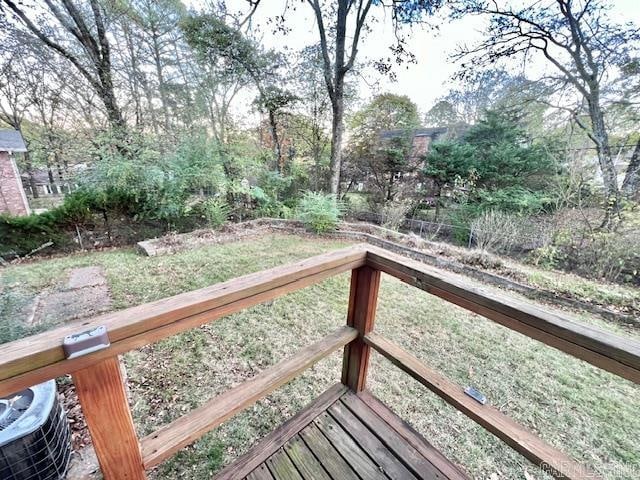 wooden terrace featuring cooling unit