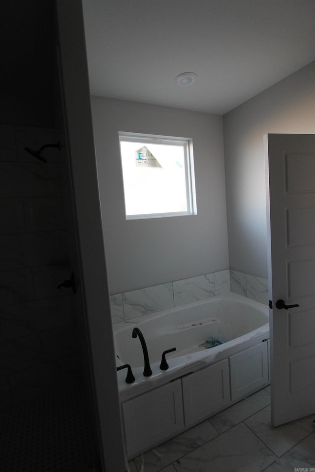 bathroom featuring a tub