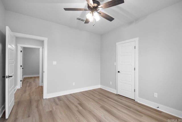 unfurnished room featuring ceiling fan and light hardwood / wood-style flooring