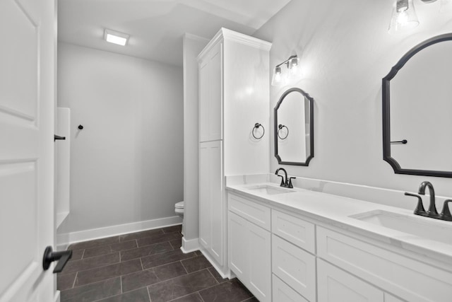 bathroom featuring vanity, toilet, and tile patterned flooring