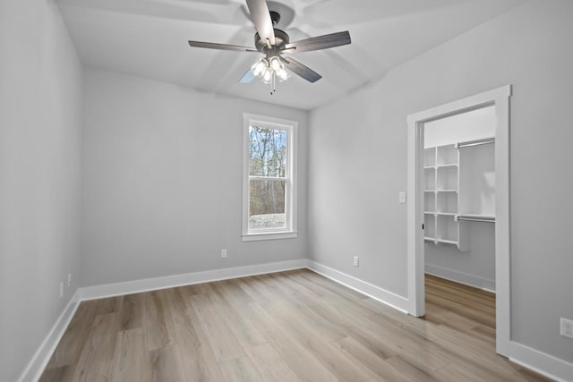 unfurnished room featuring ceiling fan and light hardwood / wood-style flooring