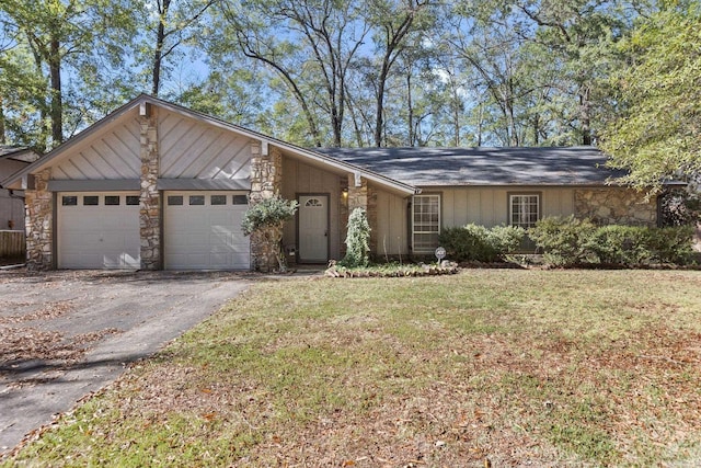 single story home with a front lawn and a garage