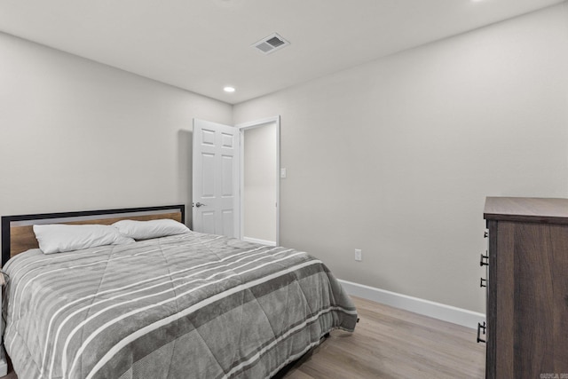 bedroom with light hardwood / wood-style floors