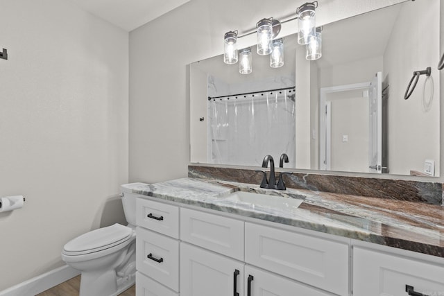 bathroom with a shower with curtain, vanity, hardwood / wood-style flooring, and toilet