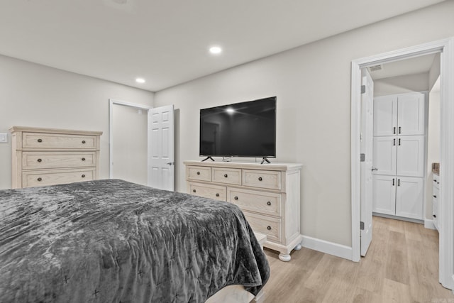 bedroom with light wood-type flooring