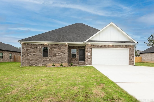 view of front of home featuring a garage and a front yard