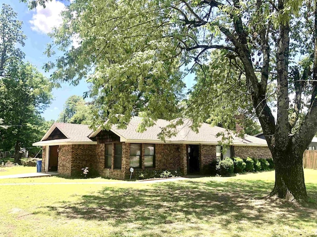 2509 Cherry St, Corning, AR 72422 - view of front facade featuring a front lawn and brick siding