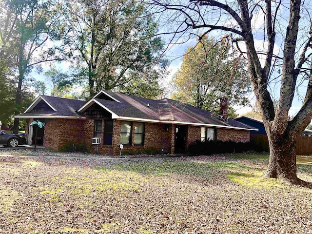 ranch-style home featuring cooling unit