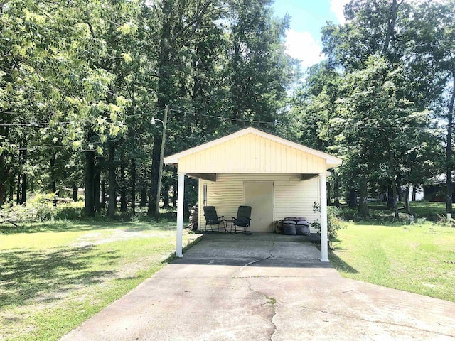 2509 Cherry St, Corning, AR 72422 - view of vehicle parking featuring a carport and concrete driveway