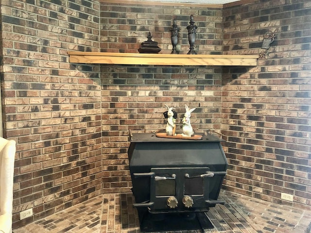2509 Cherry St, Corning, AR 72422 - detailed view of a wood stove and brick wall