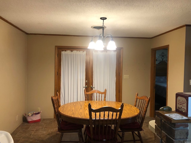 dining room with crown molding, a chandelier, and a textured ceiling