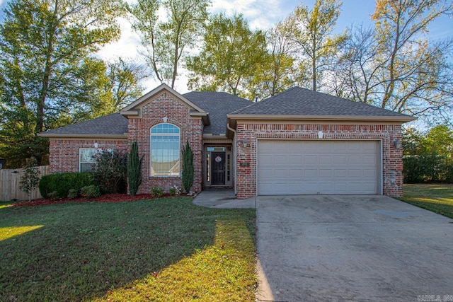 view of front of home featuring a front yard and a garage