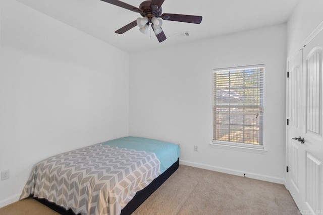 carpeted bedroom featuring ceiling fan