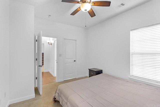 bedroom featuring ceiling fan and light colored carpet