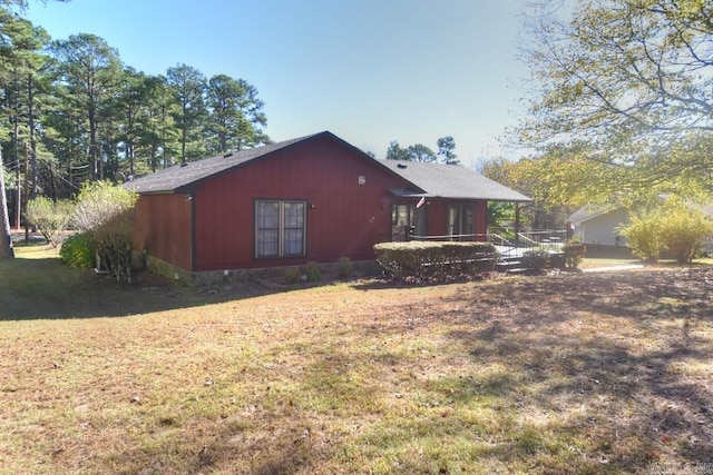 back of house with a yard