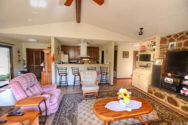 living room with hardwood / wood-style floors, vaulted ceiling with beams, and ceiling fan