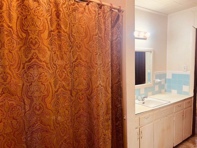 bathroom featuring vanity and crown molding