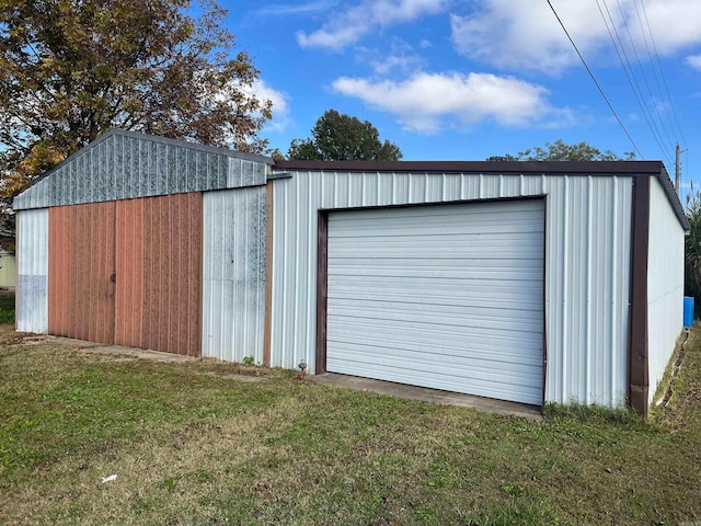 garage featuring a yard