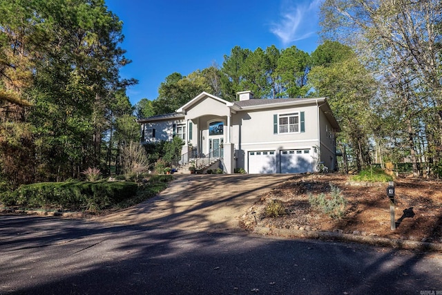 split foyer home featuring a garage