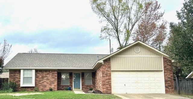 single story home featuring a front yard and a garage