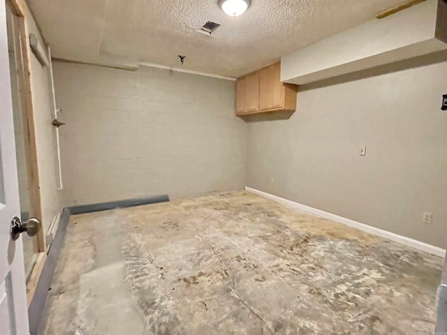 laundry area with a textured ceiling