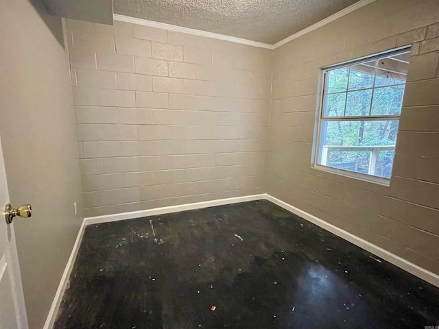 unfurnished room with a textured ceiling and crown molding