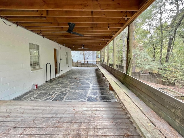 wooden terrace featuring ceiling fan